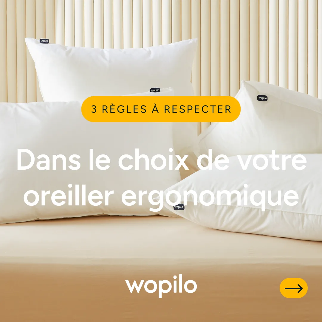 Oreillers blancs sur tête de lit cannelée, ouverture d’un carrousel conseils.