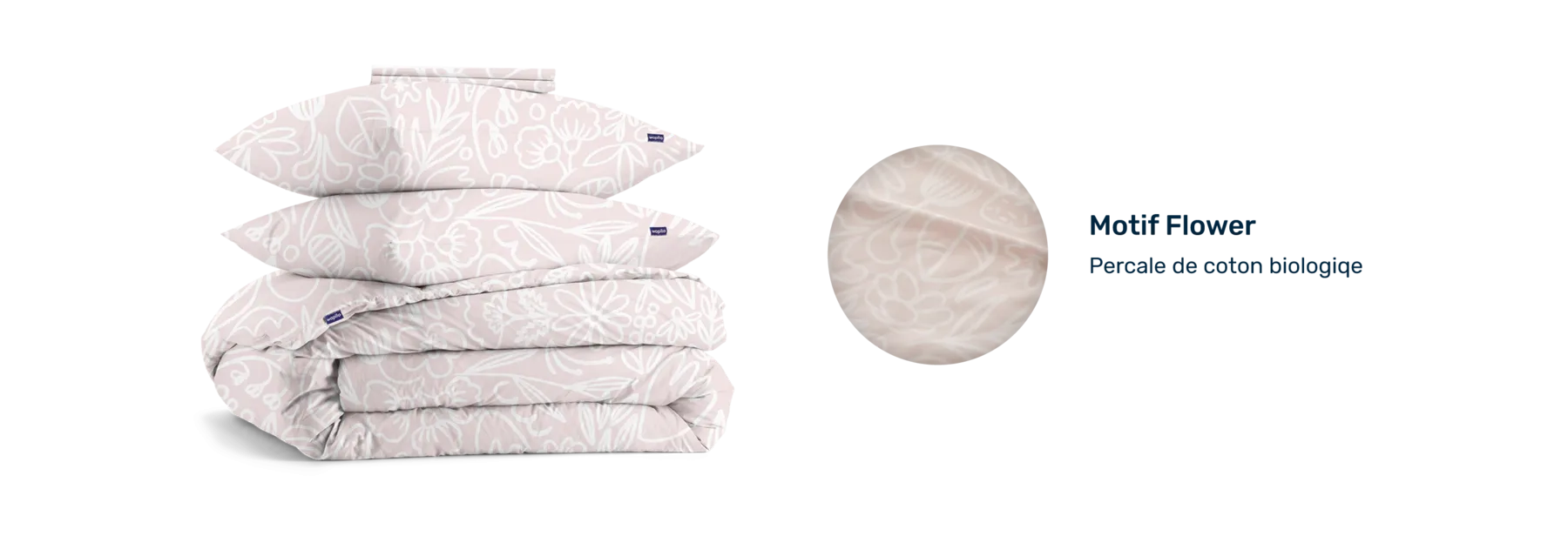Pile de linge plié et pastille présentant le motif en percale biologique.